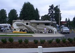 The Windseeker in its space  in Van Mall RV Park with Libby and the two Westies